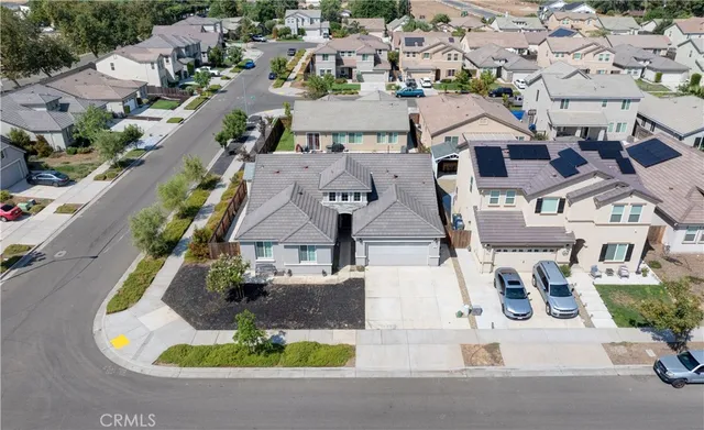 a view of backyard with swimming pool and outdoor seating