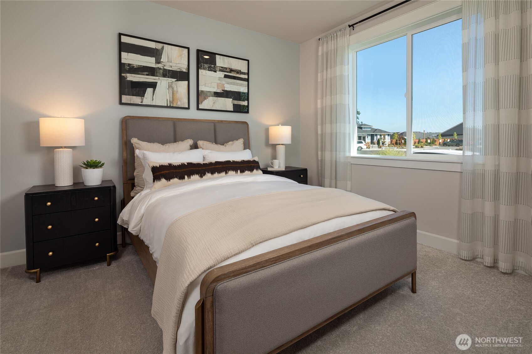 2543 Acer Loop Southeast Lacey, WA 98513 - Photo 11 of 25 a bedroom with a bed and a night stand