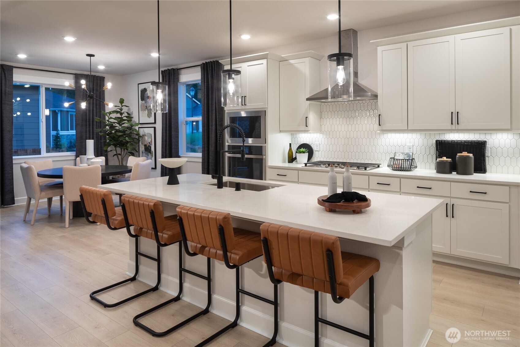 2543 Acer Loop Southeast Lacey, WA 98513 - Photo 4 of 25 a kitchen with a table chairs stove and microwave