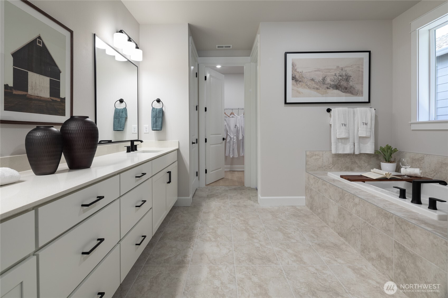 2543 Acer Loop Southeast Lacey, WA 98513 - Photo 7 of 25 a spacious bathroom with a double vanity sink a mirror and a bathtub