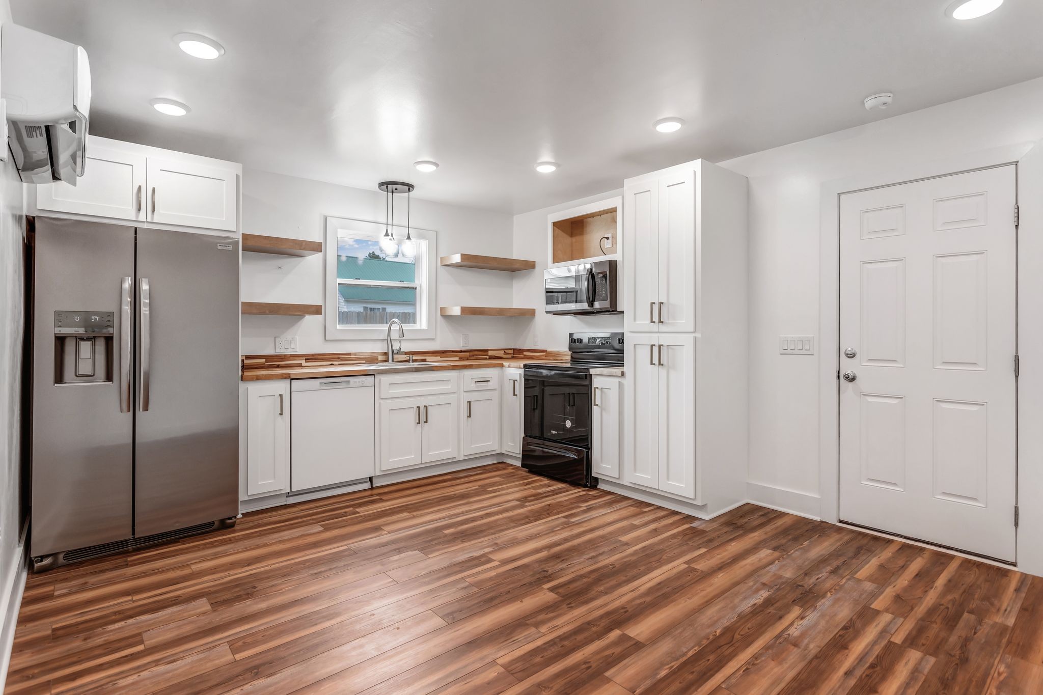 107 Shady Street Summertown, TN 38483 - Photo 29 of 31 a kitchen with stainless steel appliances a refrigerator sink and cabinets