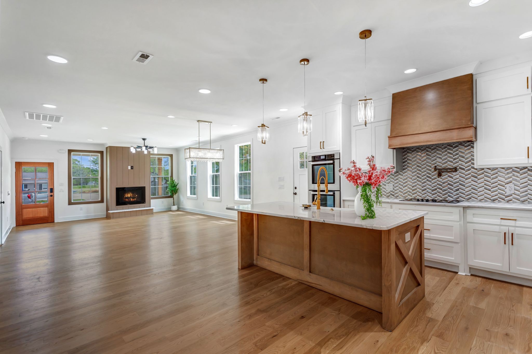 107 Shady Street Summertown, TN 38483 - Photo 10 of 31 a kitchen with stainless steel appliances granite countertop a stove and a wooden floors