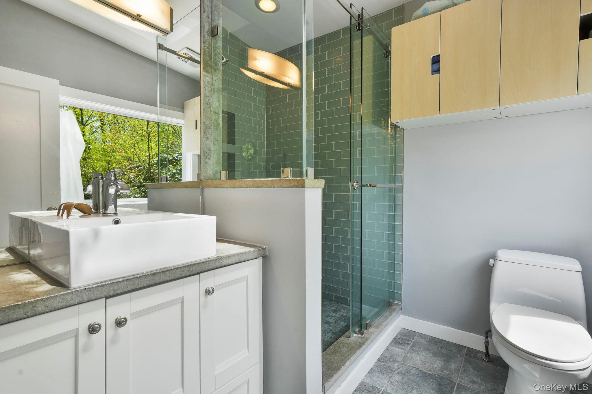 44 Tompkins Road Carmel, NY 10512 - Photo 16 of 31 a bathroom with a sink toilet and shower