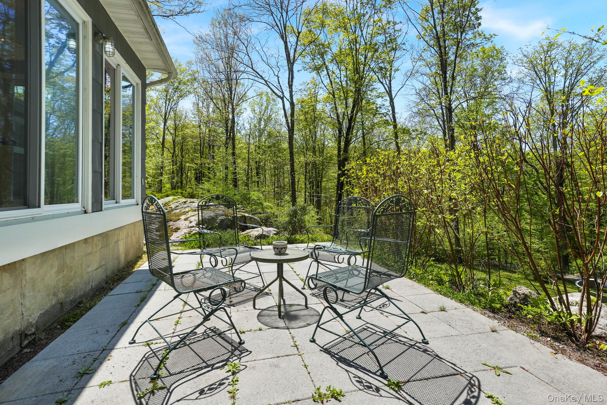 44 Tompkins Road Carmel, NY 10512 - Photo 25 of 31 a view of a patio with table and chairs and potted plants