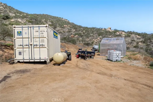 an aerial view of residential houses with outdoor space and mountain view