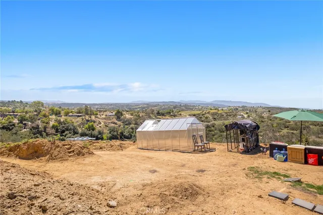 an aerial view of residential houses with city view