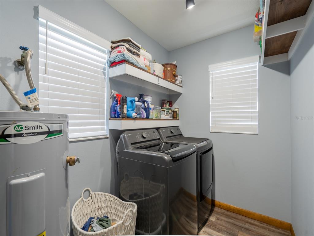 4381 Northeast 105th Place Anthony, FL 32617 - Photo 16 of 49 a kitchen with a wooden floor and a sink