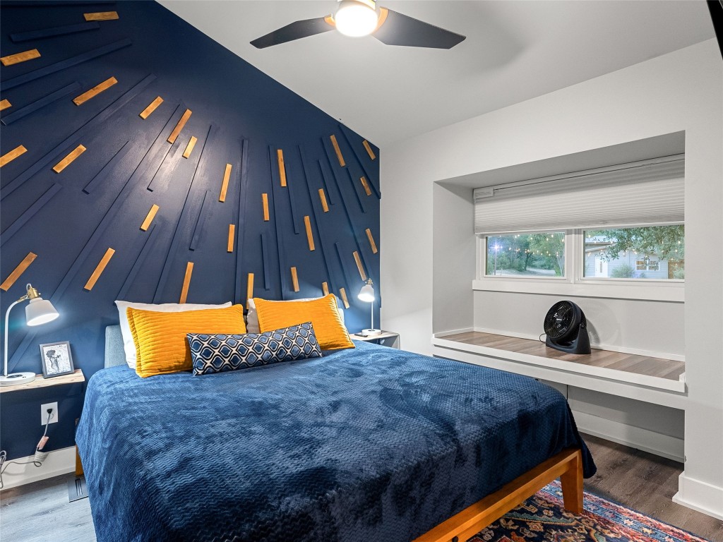 3500 R O Drive Spicewood, TX 78669 - Photo 35 of 40 a bedroom with a bed and a chandelier