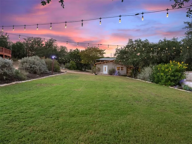 a large white building with glass windows and painted walls