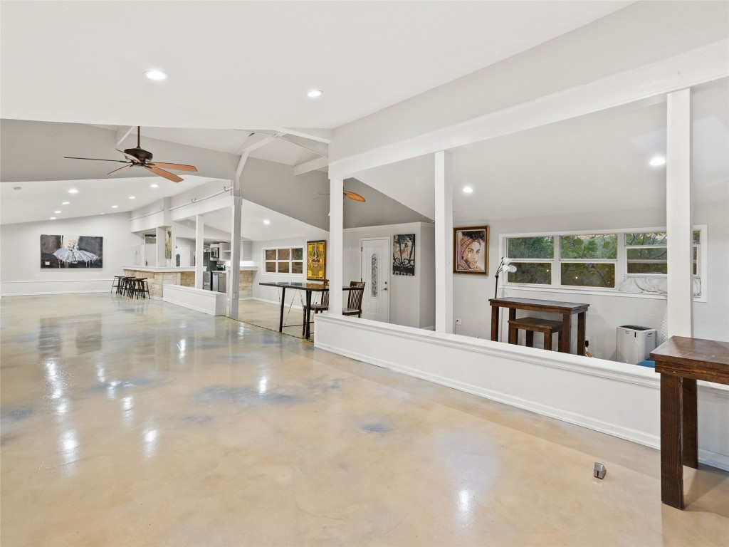 3500 R O Drive Spicewood, TX 78669 - Photo 38 of 40 a large white building with glass windows and painted walls