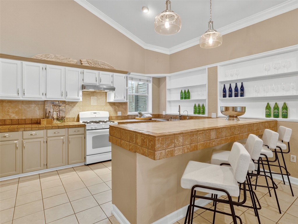 3500 R O Drive Spicewood, TX 78669 - Photo 6 of 40 a living room with kitchen island granite countertop furniture and a kitchen view