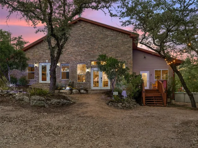 a bedroom with furniture and a flat screen tv