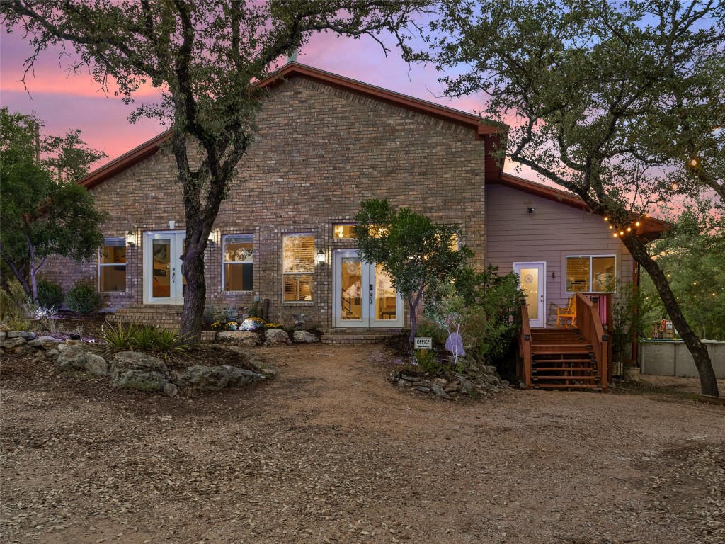 3500 R O Drive Spicewood, TX 78669 - Photo 9 of 40 a front view of a house with garden