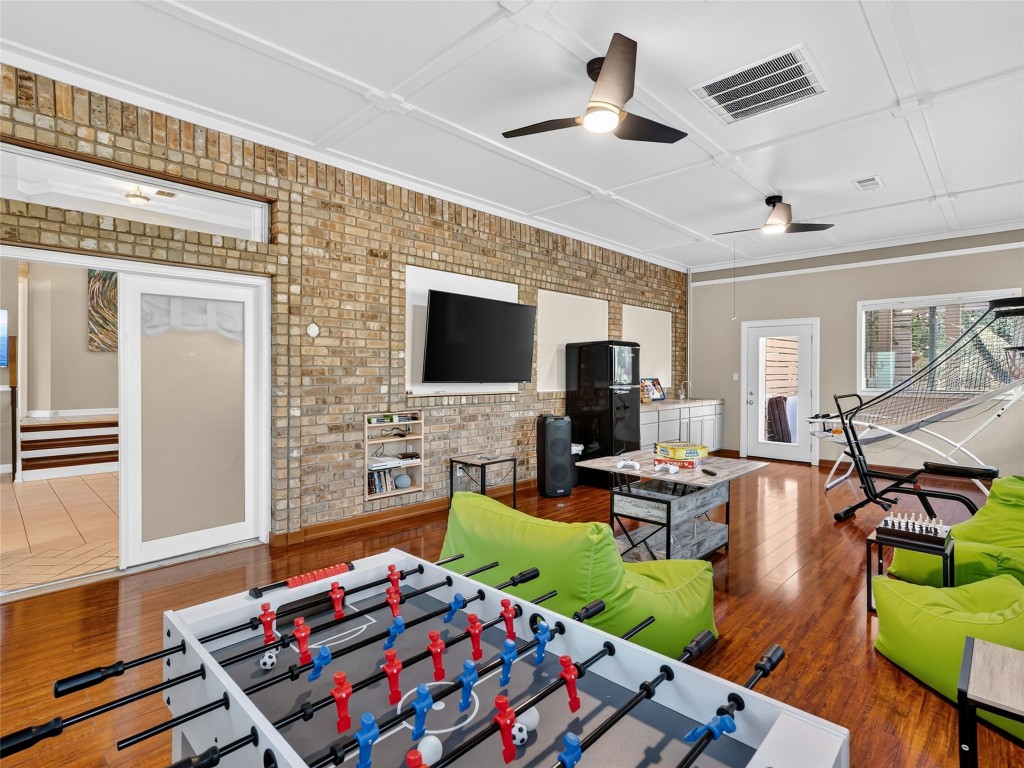 3500 R O Drive Spicewood, TX 78669 - Photo 10 of 40 a bedroom with furniture and a flat screen tv