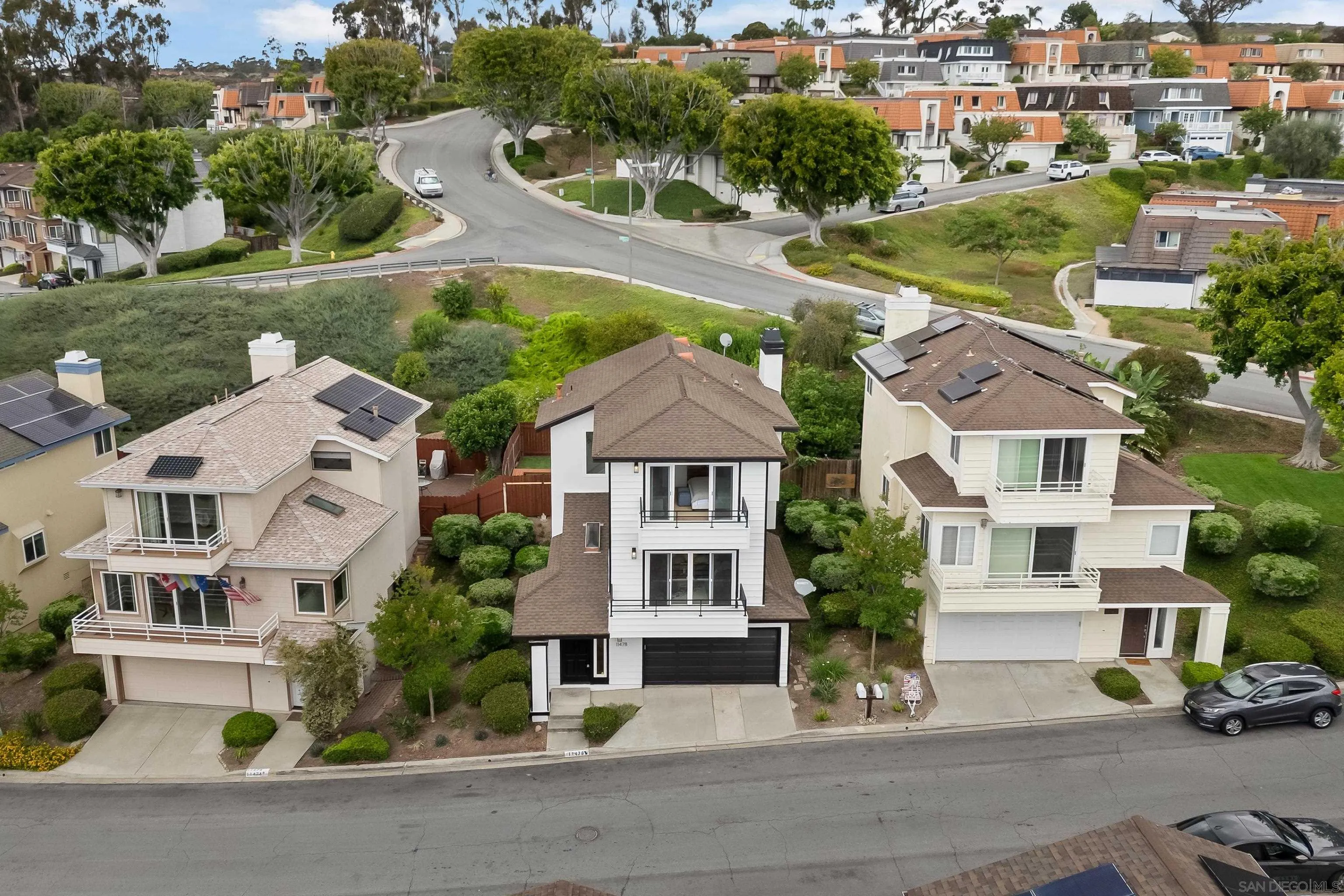 11478 Madera Rosa Way San Diego, CA 92124 - Photo 41 of 54 an aerial view of multiple houses with a yard