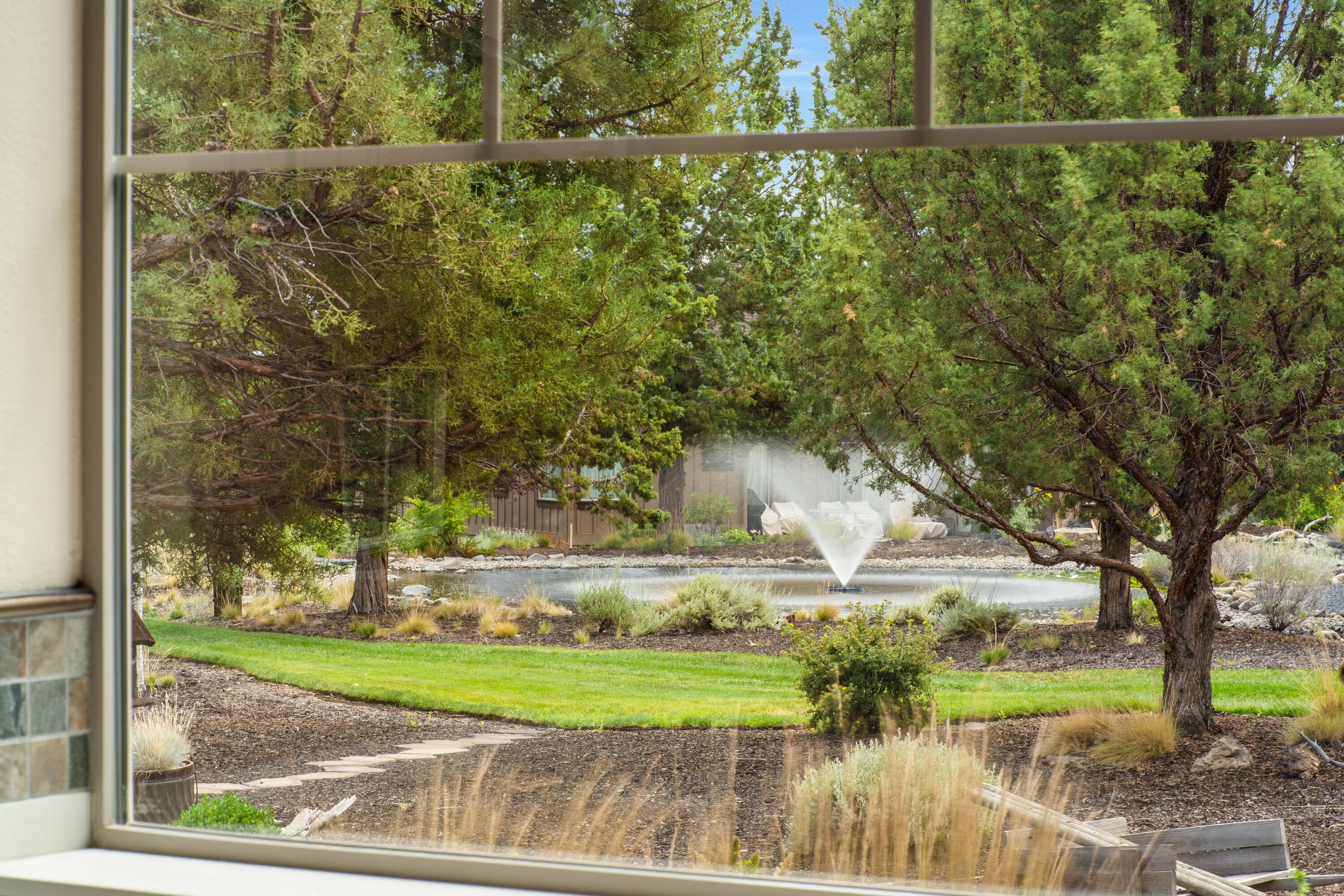 205 Vista Rim Drive Redmond, OR 97756 - Photo 27 of 85 a view of a lake from a yard