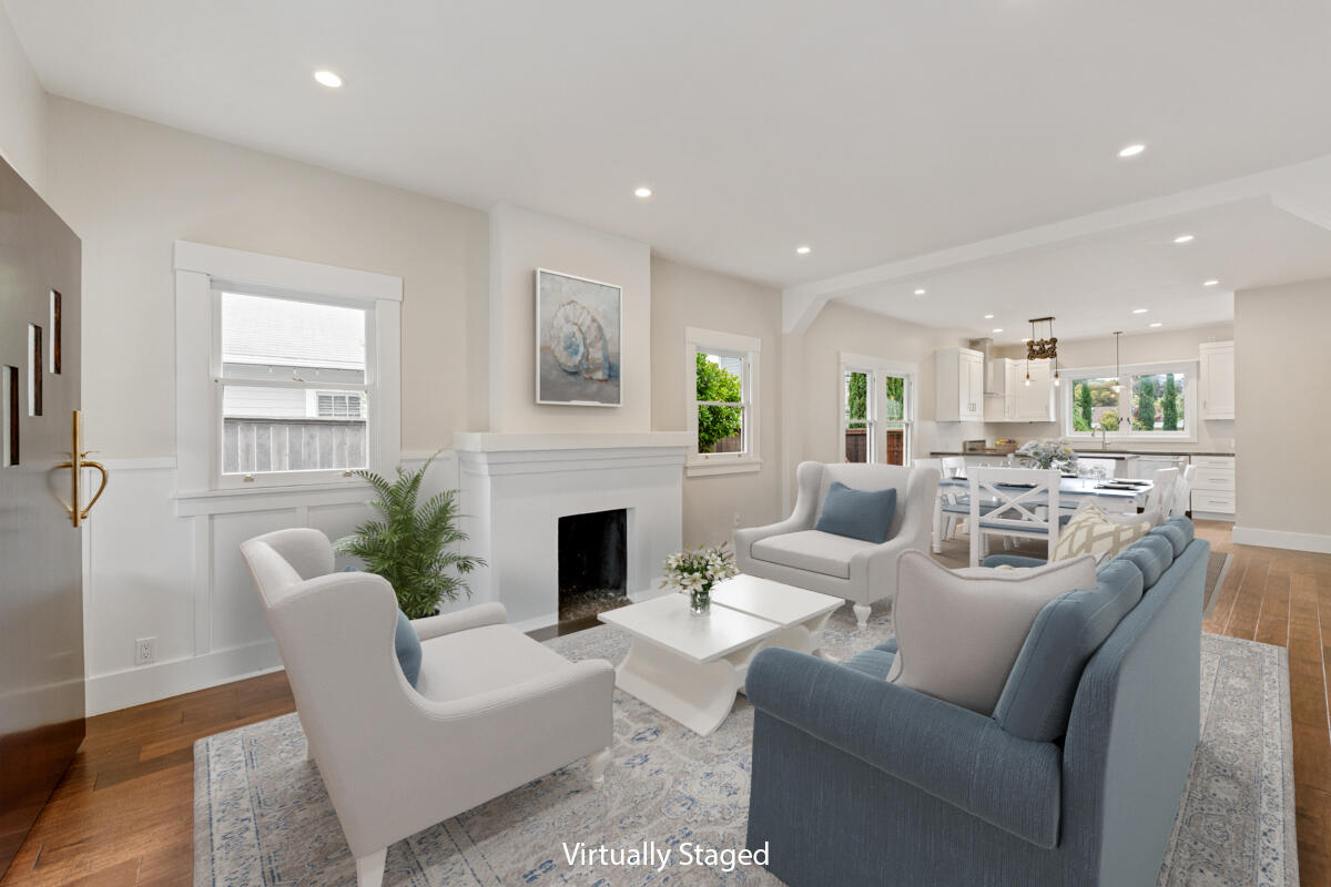 1309 Castillo Street Santa Barbara, CA 93101 - Photo 13 of 41 a living room with furniture a fireplace and a potted plant