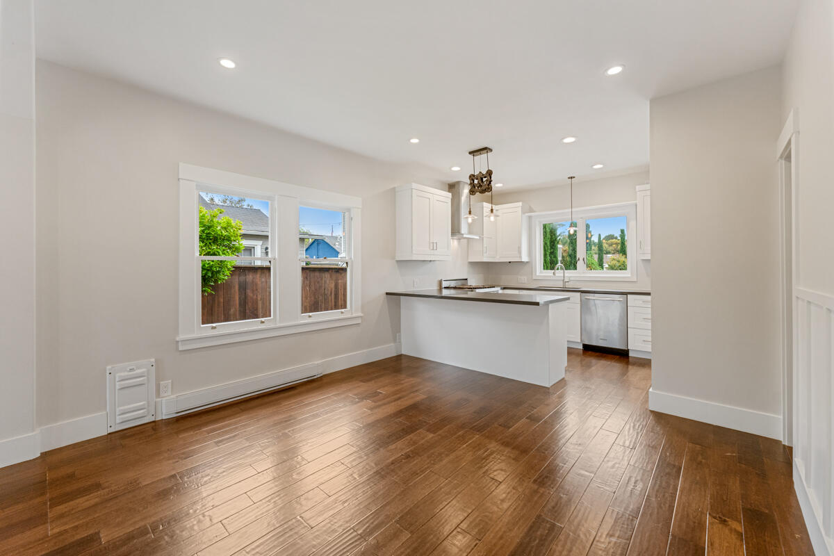 1309 Castillo Street Santa Barbara, CA 93101 - Photo 14 of 41 a view of a kitchen with a sink wooden cabinets and a window