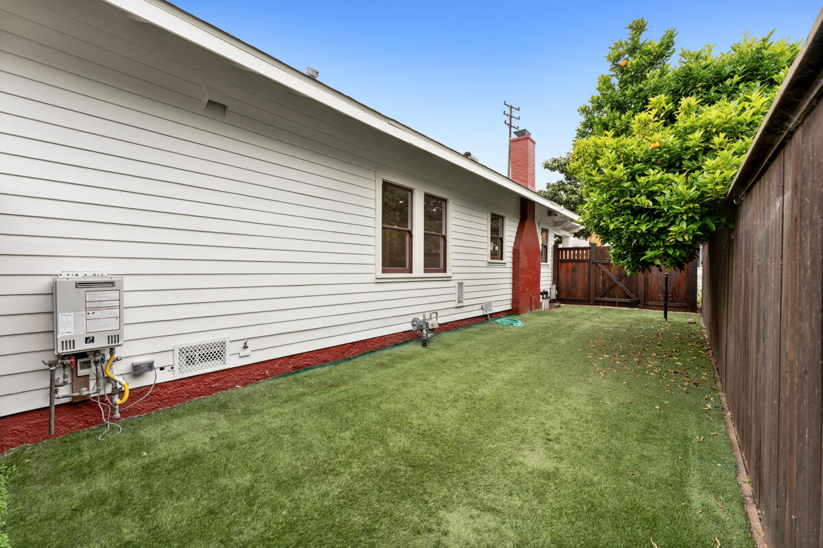1309 Castillo Street Santa Barbara, CA 93101 - Photo 33 of 41 a backyard of a house with table and chairs