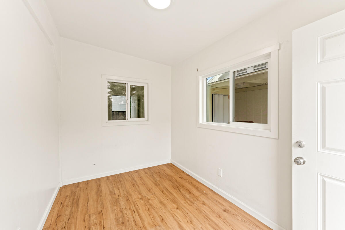 1309 Castillo Street Santa Barbara, CA 93101 - Photo 39 of 41 a view of empty room with wooden floor and fan