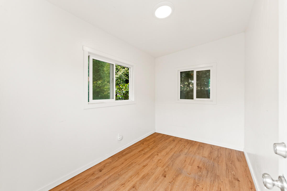 1309 Castillo Street Santa Barbara, CA 93101 - Photo 40 of 41 an empty room with wooden floor and windows