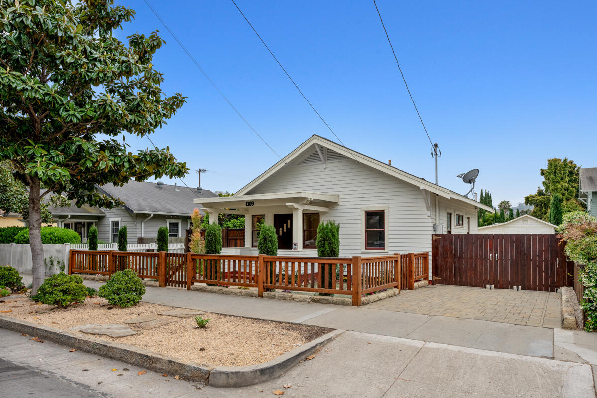 1309 Castillo Street Santa Barbara, CA 93101 - Photo 5 of 41 a view of a house with a small yard and wooden fence
