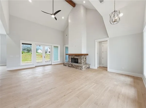 a view of a kitchen with white cabinets