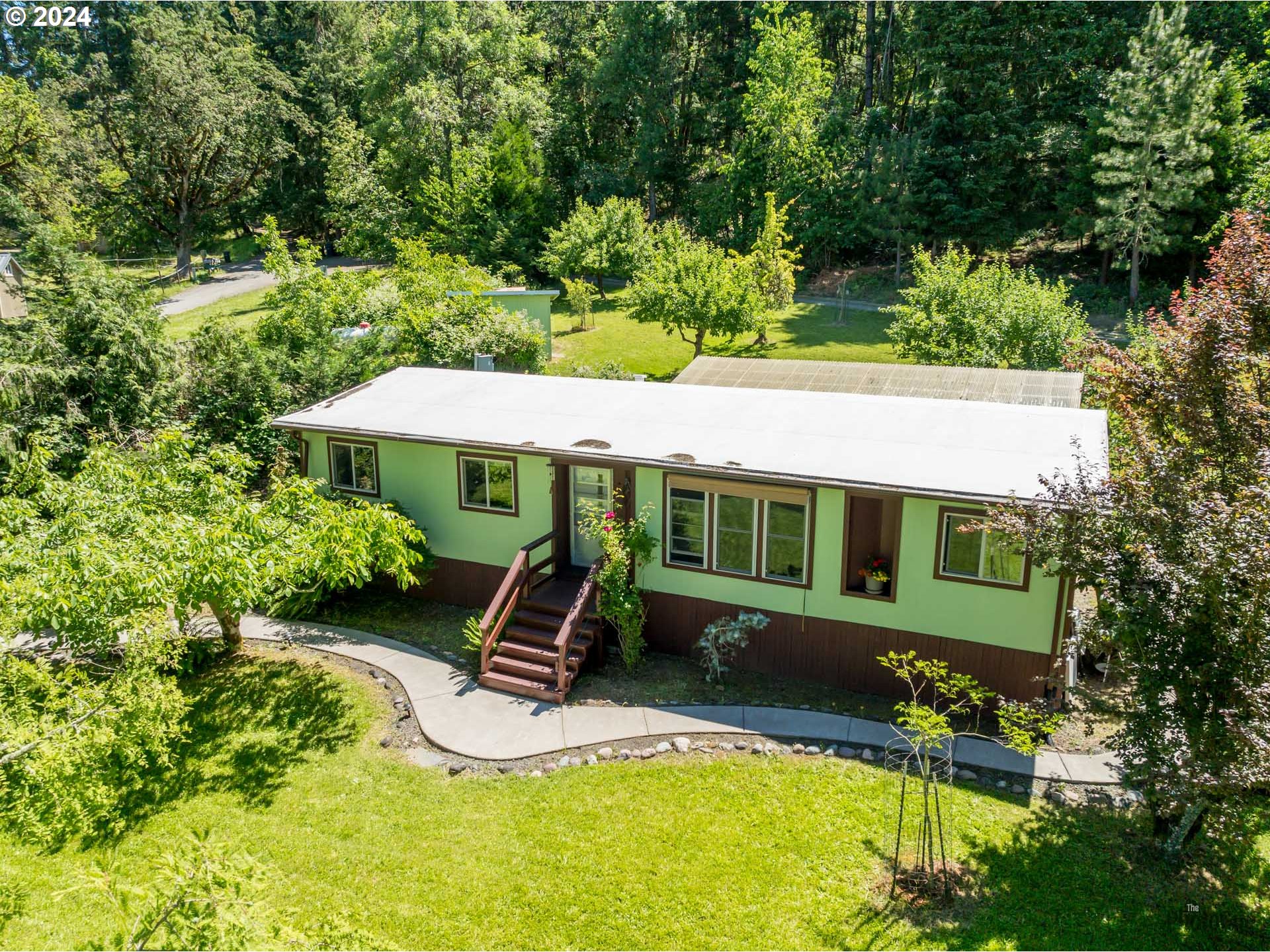 36555 Star Road Pleasant Hill, OR 97455 - Photo 1 of 1 an aerial view of a house with swimming pool and garden