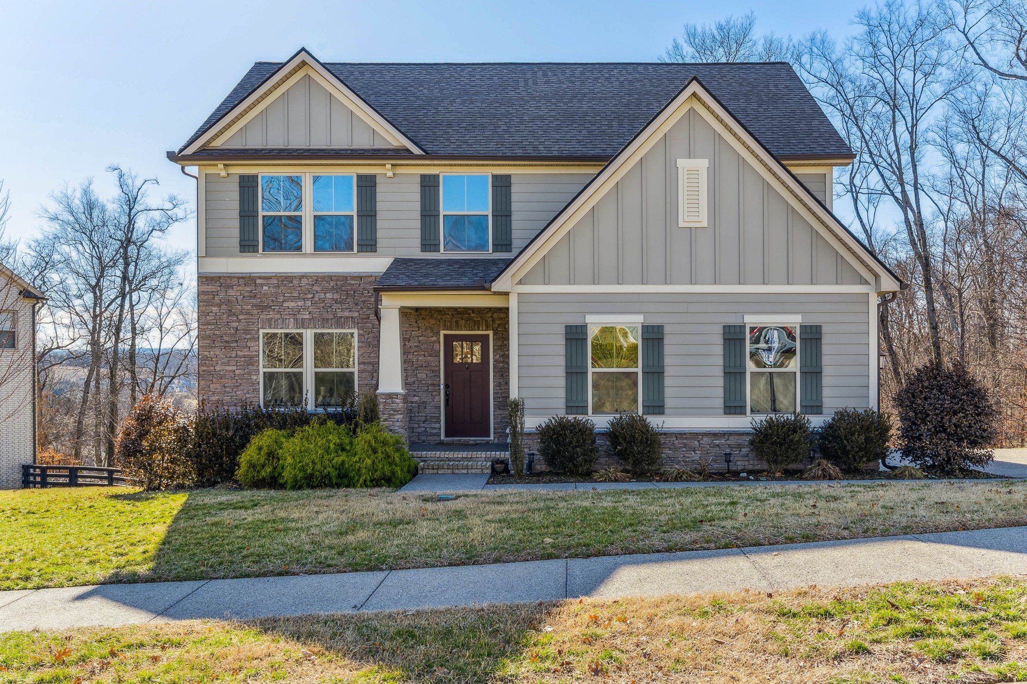 6820 Falls Ridge Lane College Grove, TN 37046 - Photo 1 of 46 a front view of a house with garden