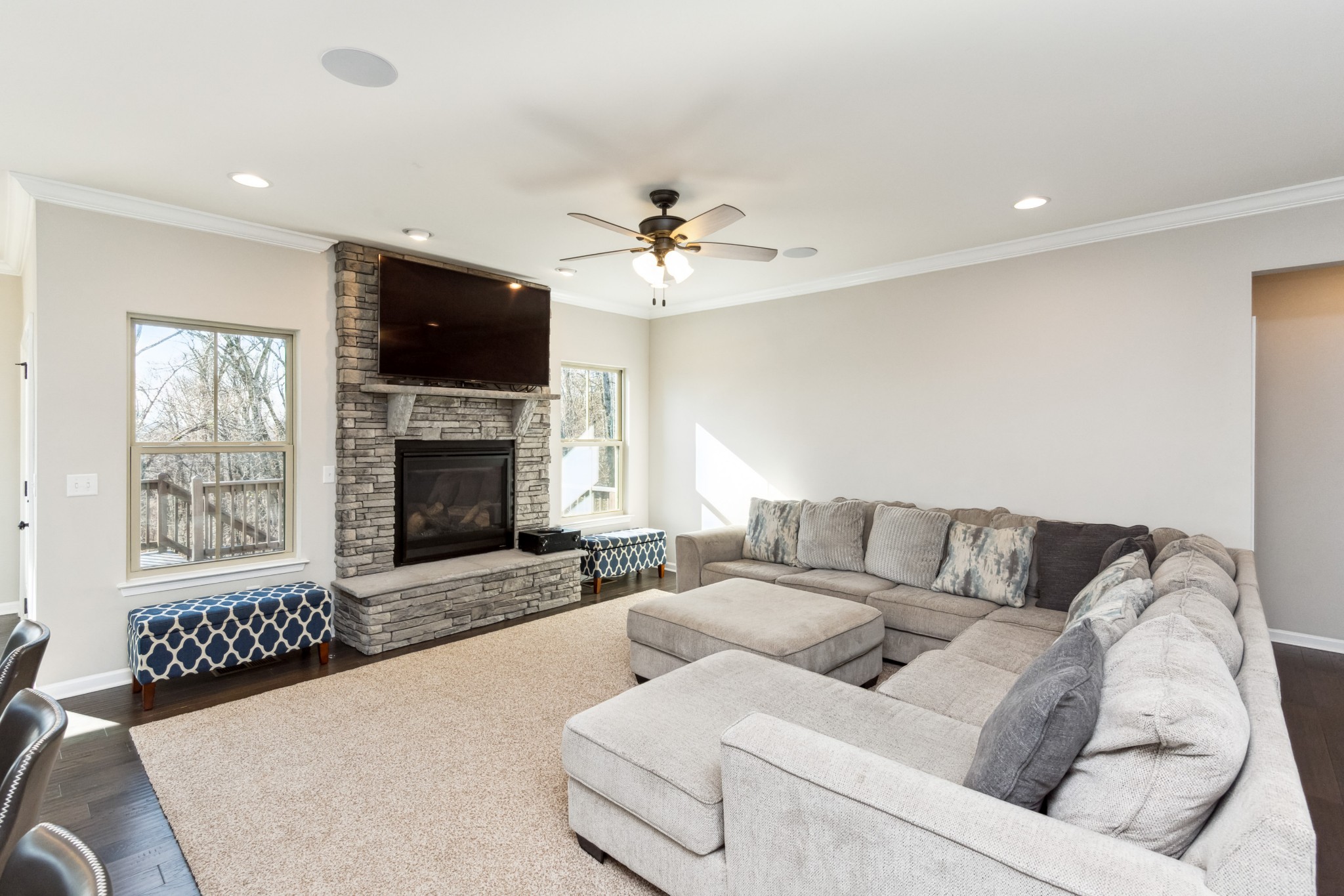 6820 Falls Ridge Lane College Grove, TN 37046 - Photo 12 of 46 a living room with furniture a flat screen tv and a fireplace