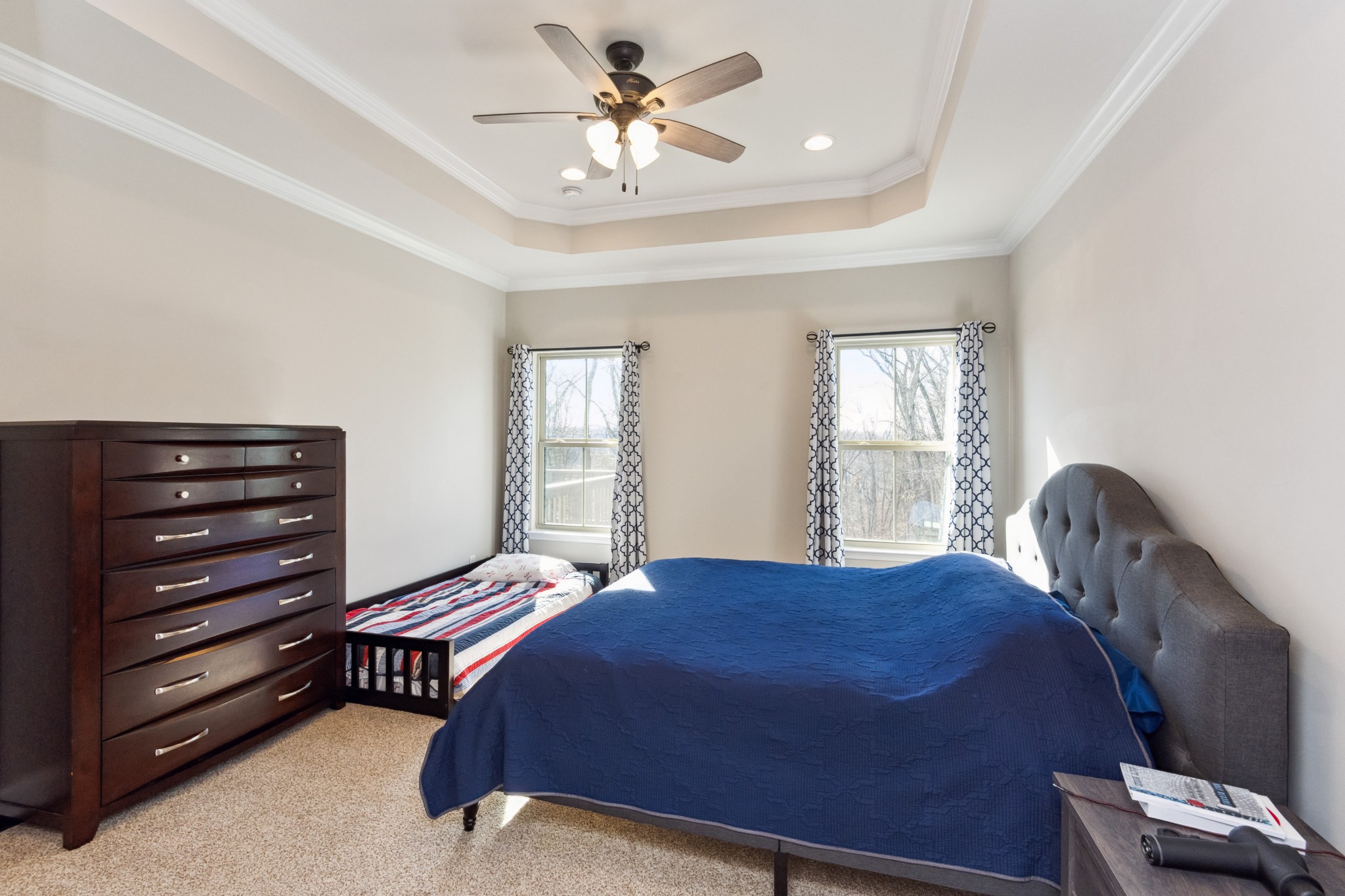 6820 Falls Ridge Lane College Grove, TN 37046 - Photo 18 of 46 a bedroom with a bed dresser and a window