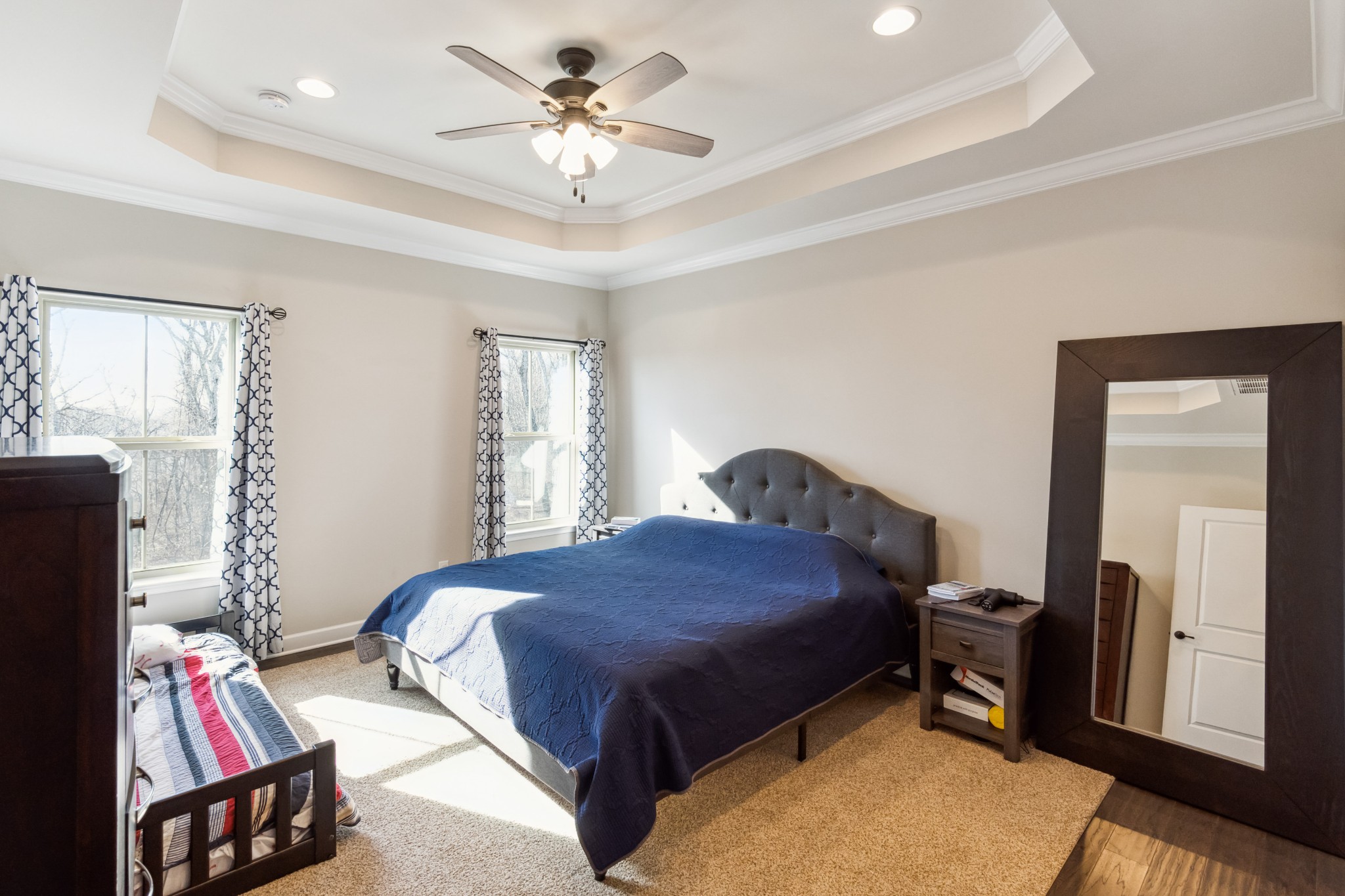 6820 Falls Ridge Lane College Grove, TN 37046 - Photo 19 of 46 a bedroom with a bed and a chandelier