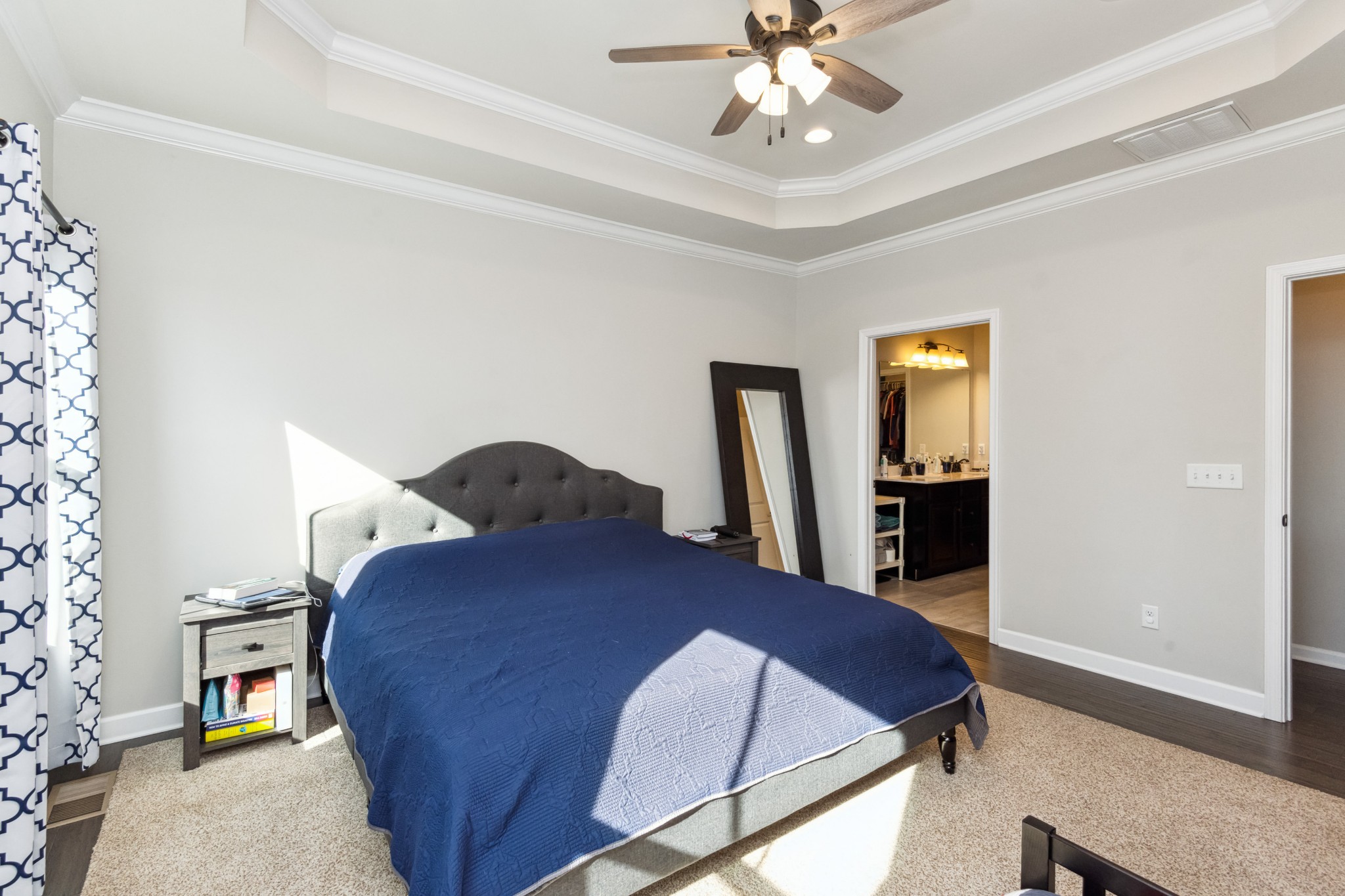 6820 Falls Ridge Lane College Grove, TN 37046 - Photo 20 of 46 a bedroom with a bed and a chandelier