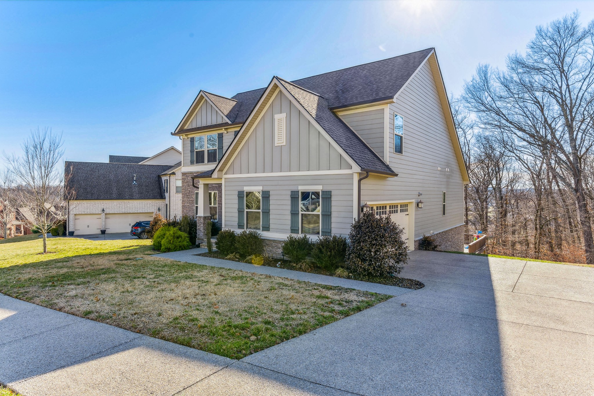 6820 Falls Ridge Lane College Grove, TN 37046 - Photo 2 of 46 a view of a house with a yard and large trees