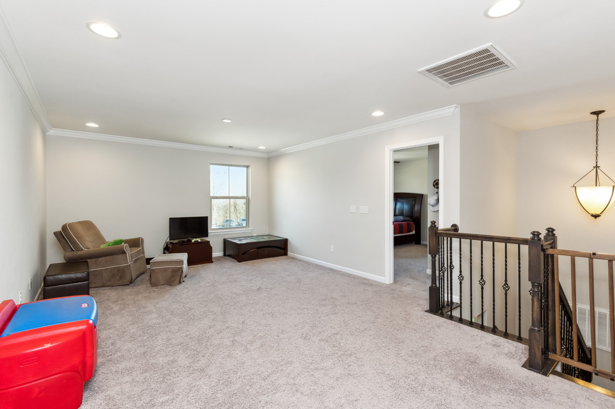 6820 Falls Ridge Lane College Grove, TN 37046 - Photo 24 of 46 a living room with furniture and a flat screen tv