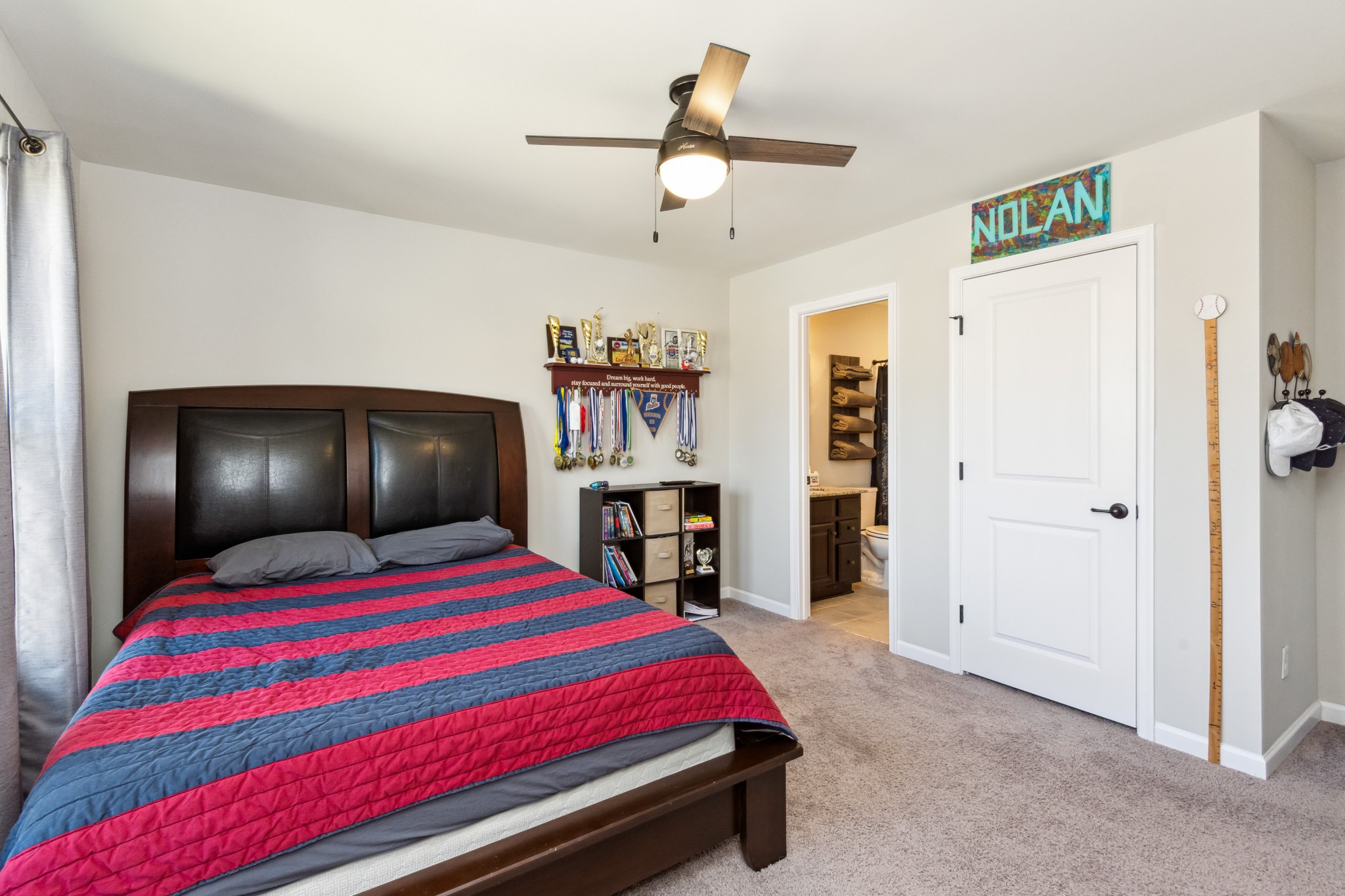 6820 Falls Ridge Lane College Grove, TN 37046 - Photo 25 of 46 a bedroom with a bed and a chandelier