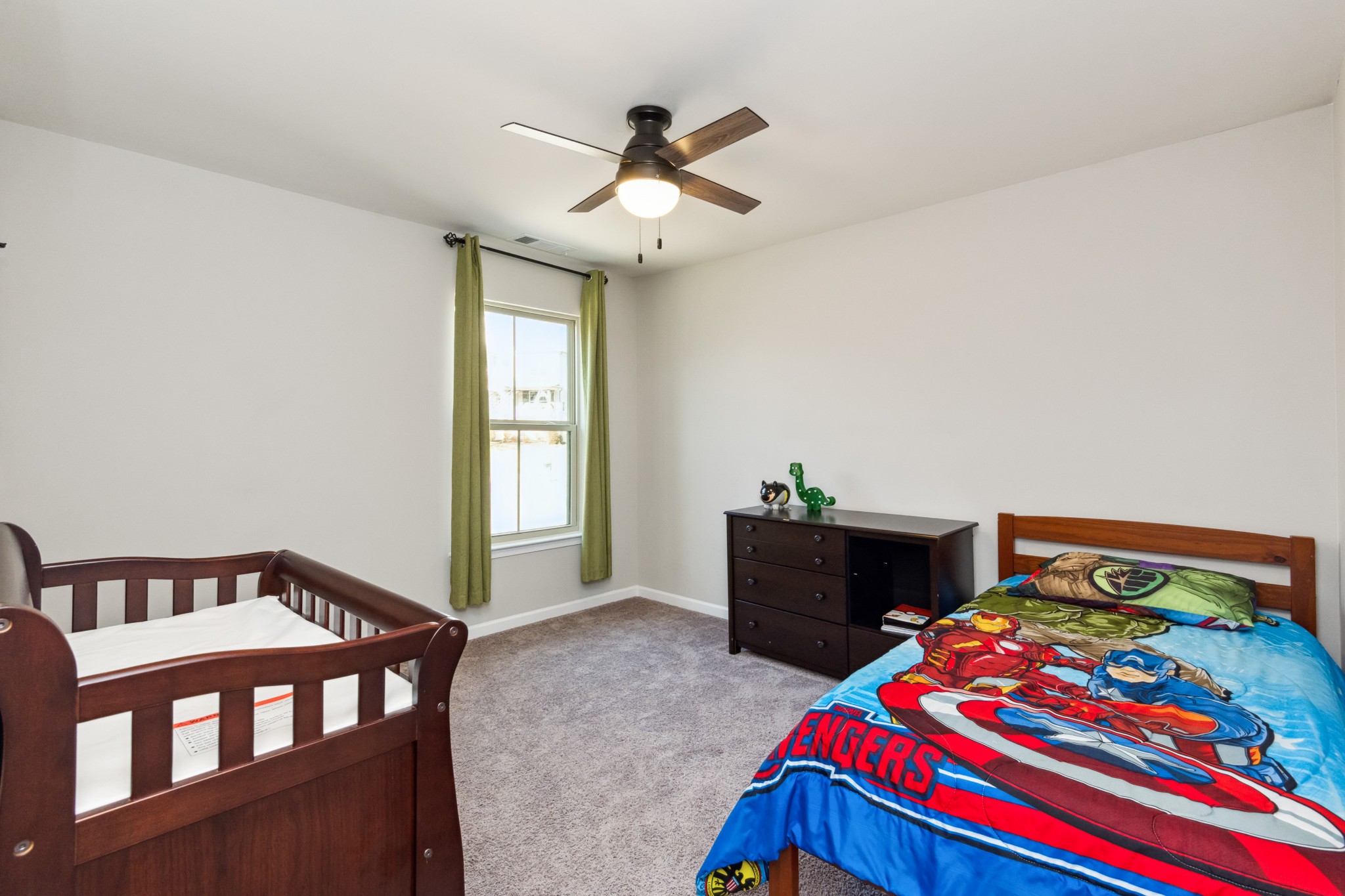 6820 Falls Ridge Lane College Grove, TN 37046 - Photo 29 of 46 a bedroom with a bed and a chandelier
