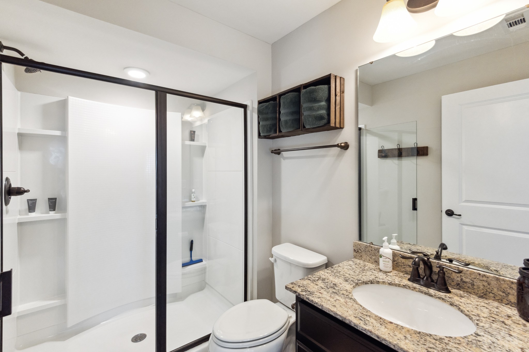 6820 Falls Ridge Lane College Grove, TN 37046 - Photo 33 of 46 a bathroom with a granite countertop sink toilet and shower