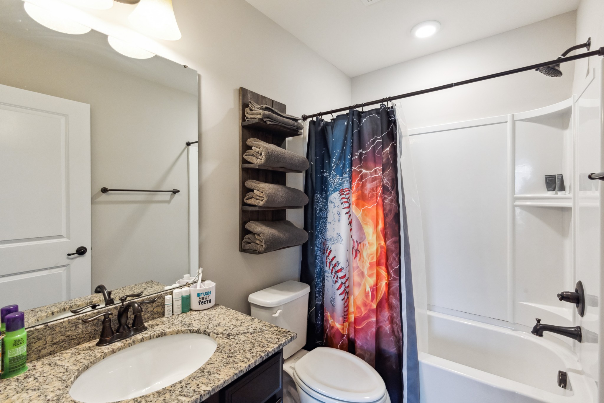 6820 Falls Ridge Lane College Grove, TN 37046 - Photo 36 of 46 a bathroom with a granite countertop sink toilet and shower