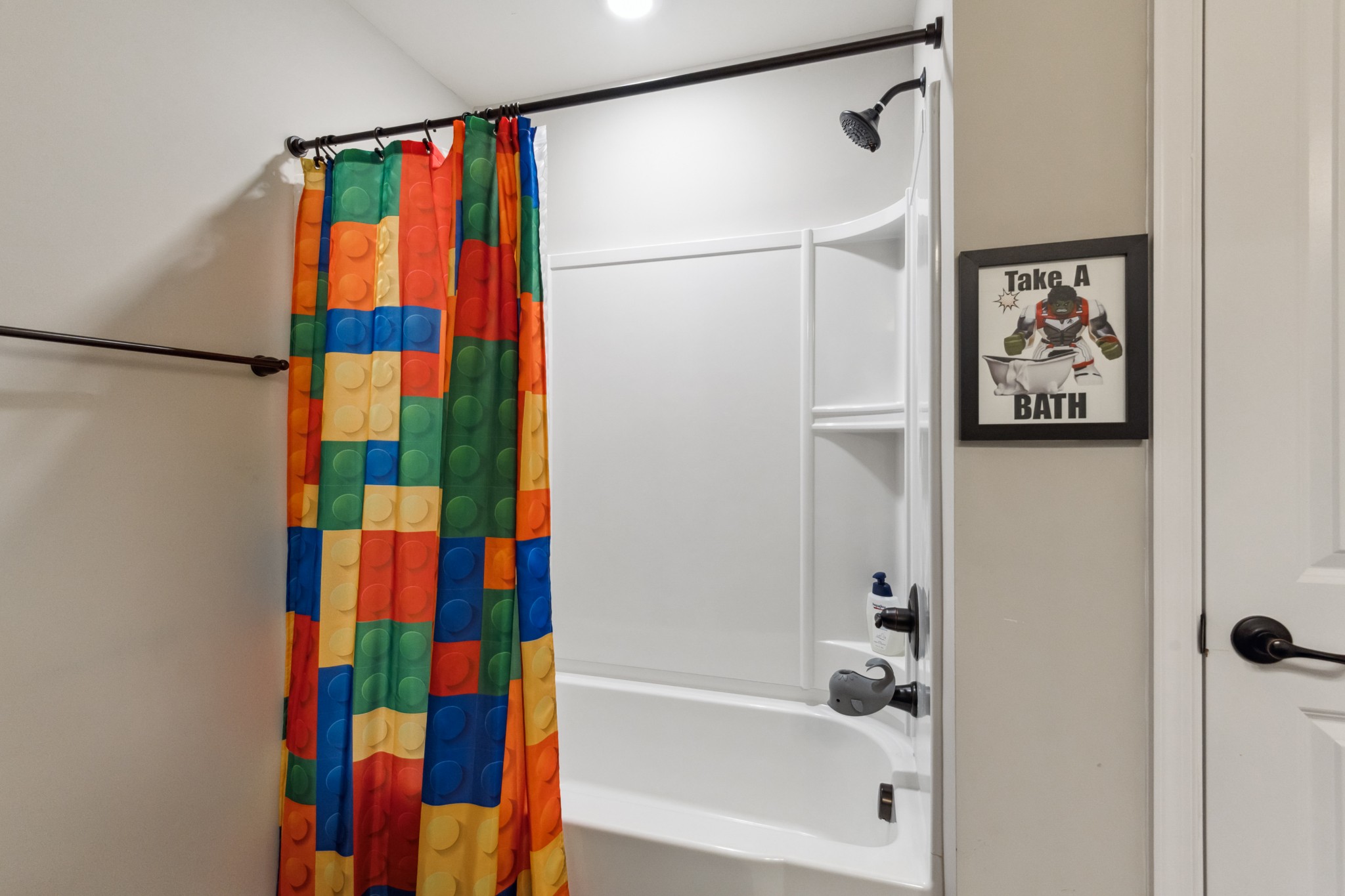 6820 Falls Ridge Lane College Grove, TN 37046 - Photo 37 of 46 a bathroom with a bathtub and a shower