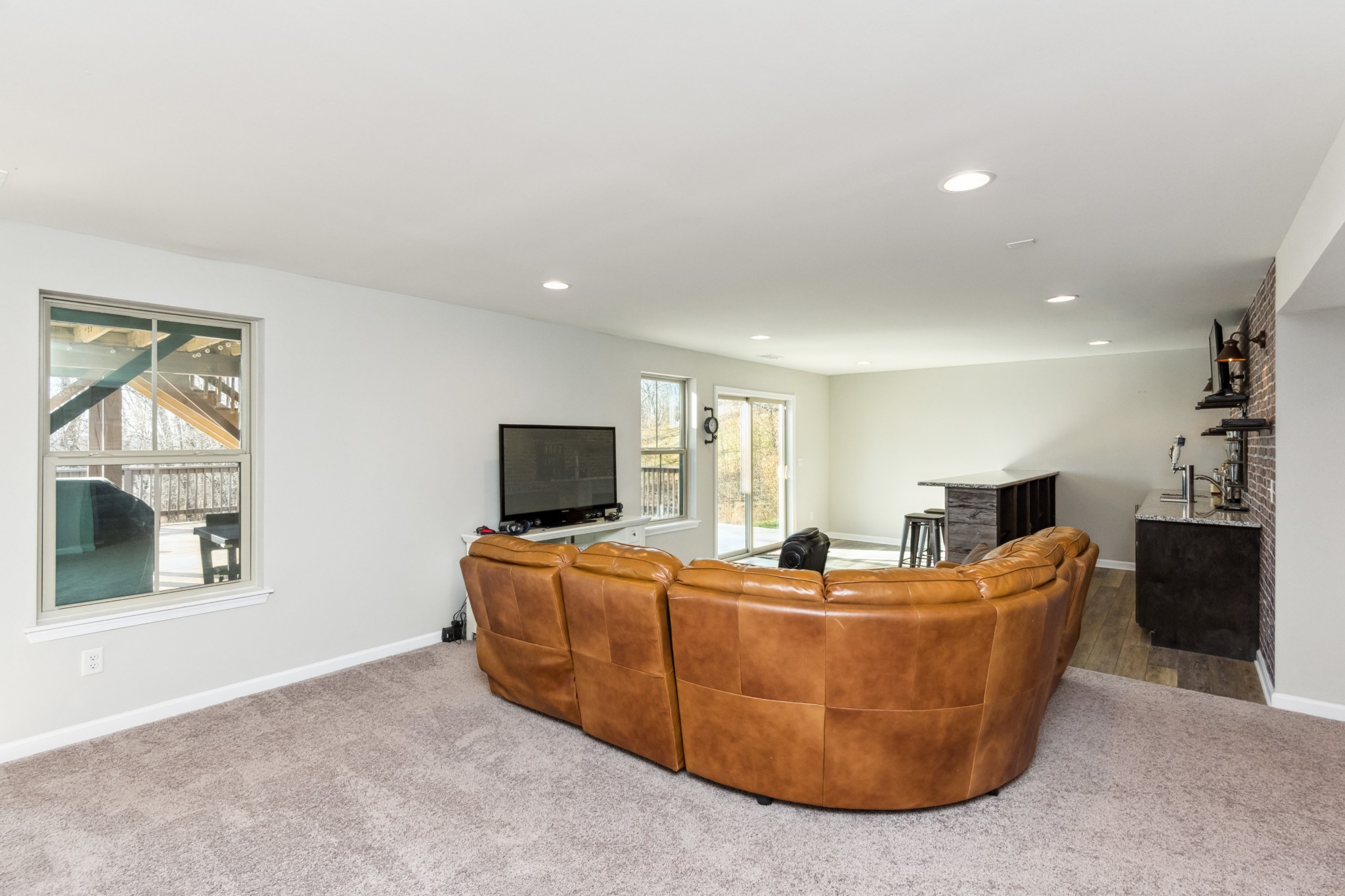 6820 Falls Ridge Lane College Grove, TN 37046 - Photo 40 of 46 a living room with furniture a flat screen tv and a large window