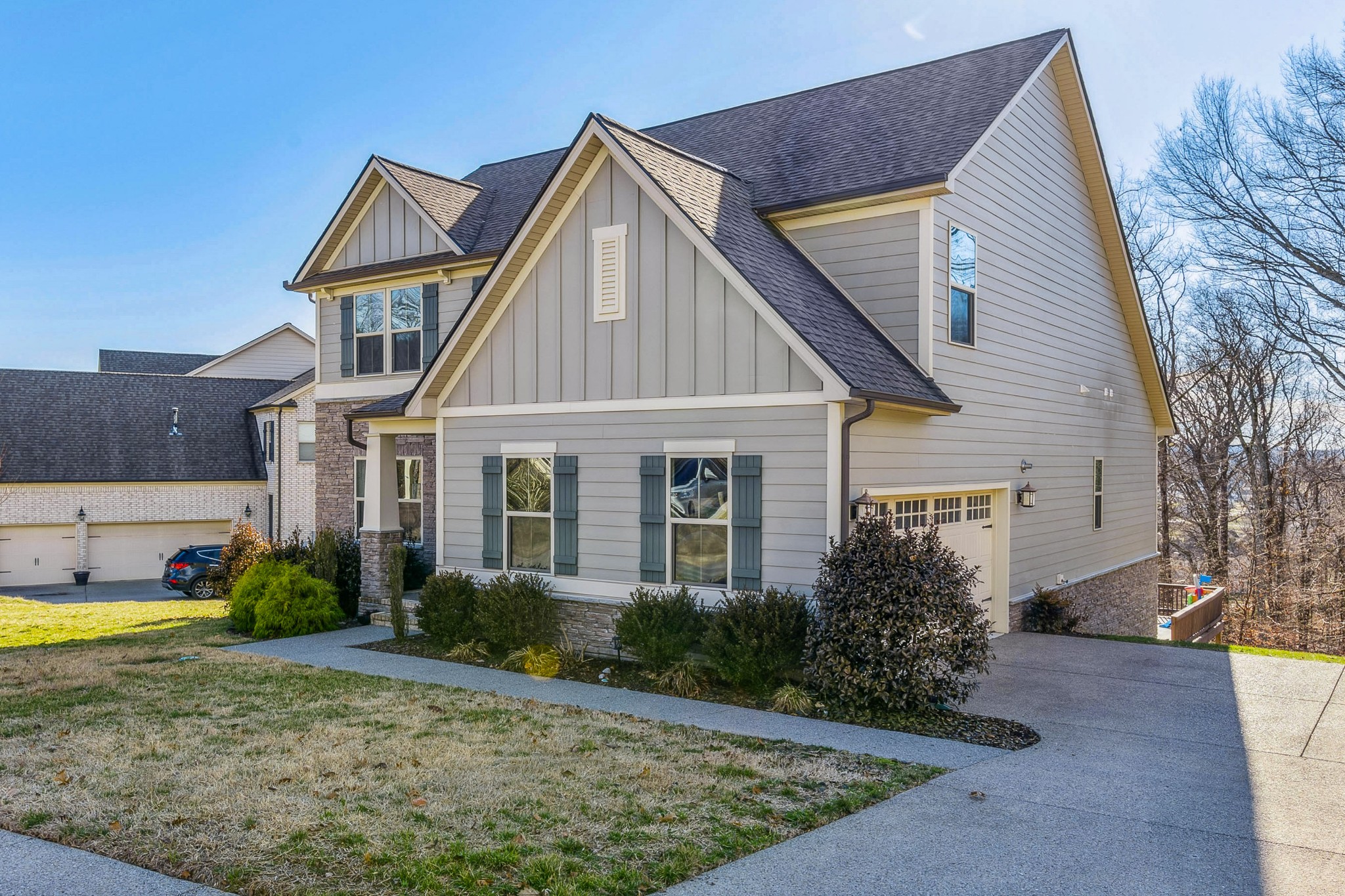 6820 Falls Ridge Lane College Grove, TN 37046 - Photo 46 of 46 a front view of a house with a yard and potted plants