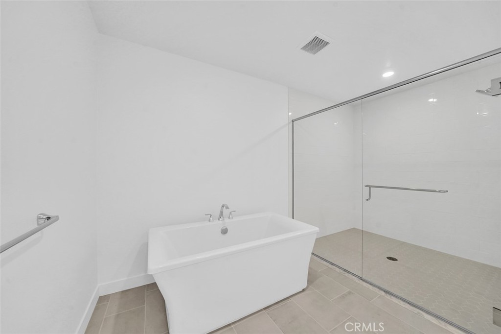 2708 Rivington Irvine, CA 92612 - Photo 12 of 24 a bathroom with a bathtub and shower