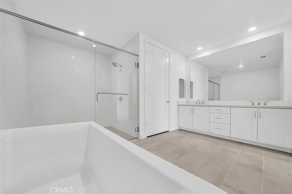 2708 Rivington Irvine, CA 92612 - Photo 10 of 24 a view of a kitchen with white cabinets
