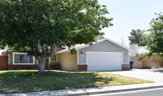 624 South Gemstone Street Ridgecrest, CA 93555 - Photo 1 of 13 front view of a house with a yard