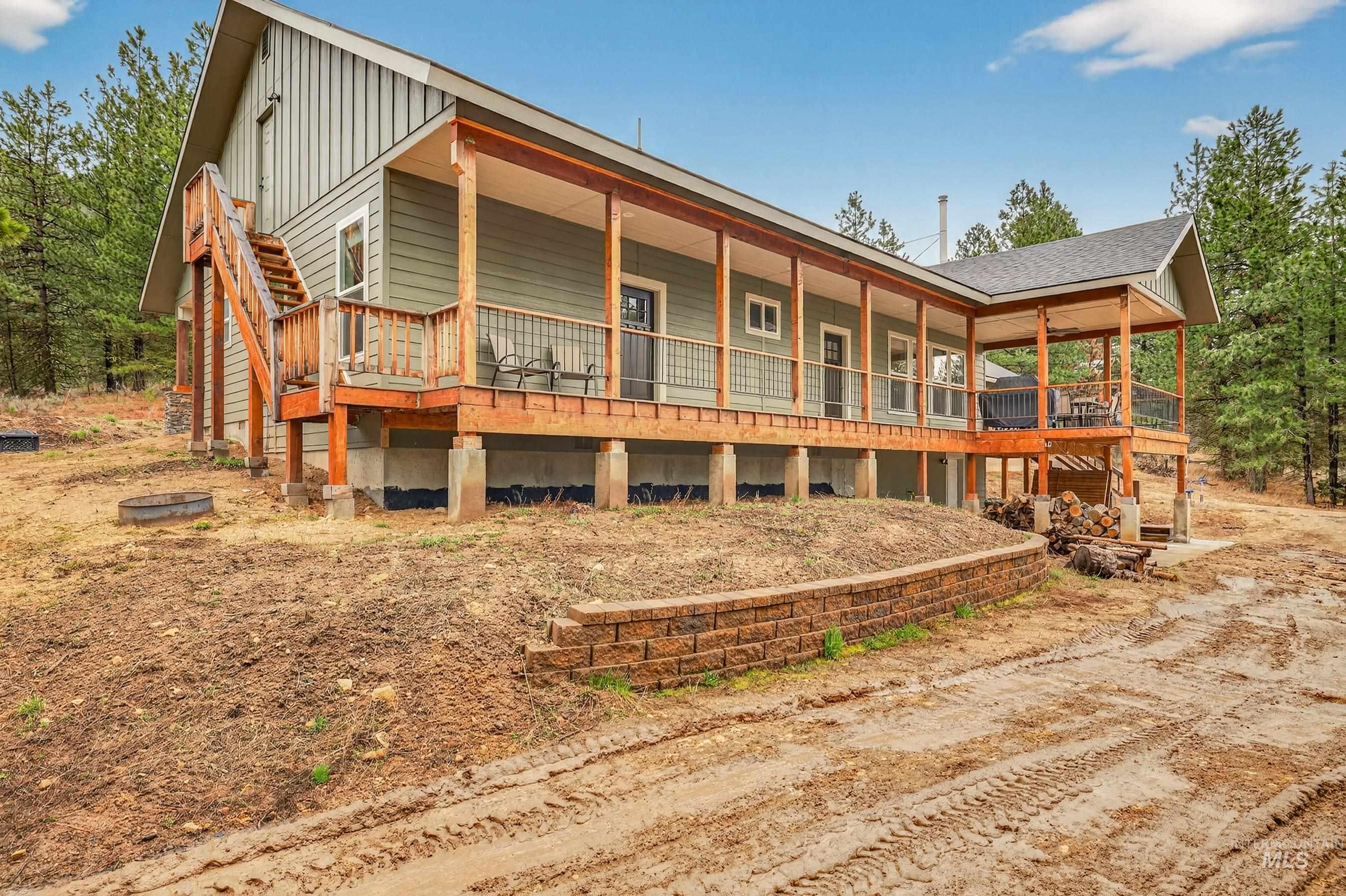 10191 Timberrim Drive Cascade, ID 83611 - Photo 6 of 44 Back of property with board and batten siding and covered porch