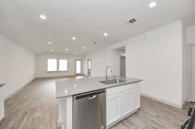 a kitchen with sink and window