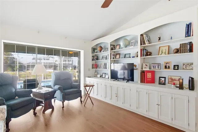 a view of a workspace with furniture and window