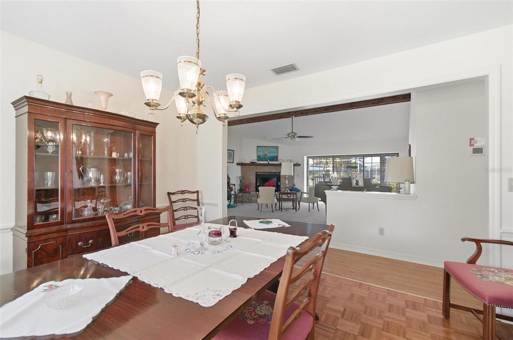 24 Chippeway Court Palm Coast, FL 32137 - Photo 14 of 69 a view of a dining room with furniture and wooden floor