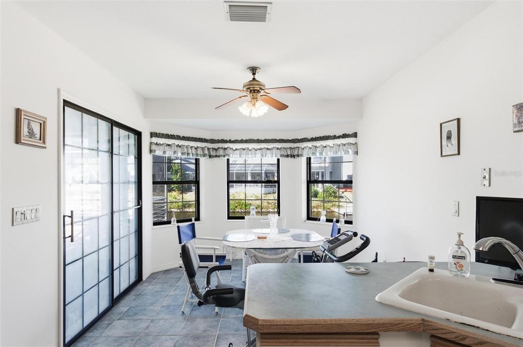 24 Chippeway Court Palm Coast, FL 32137 - Photo 20 of 69 a view of a dining room with furniture window and outside view